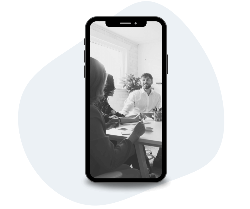 phone with picture of people in meeting displayed on screen